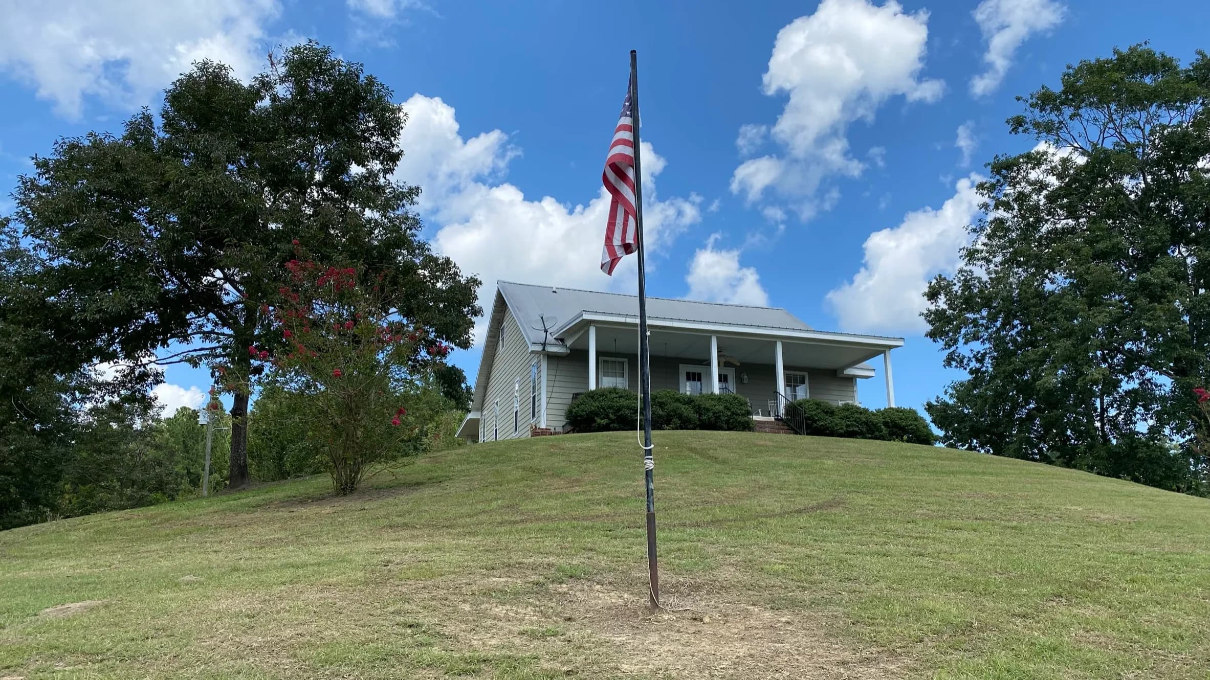 Camp House with flag